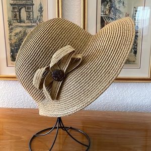 Tan straw bonnet-style hat.
